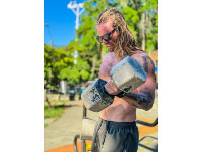 Tom lifts weights