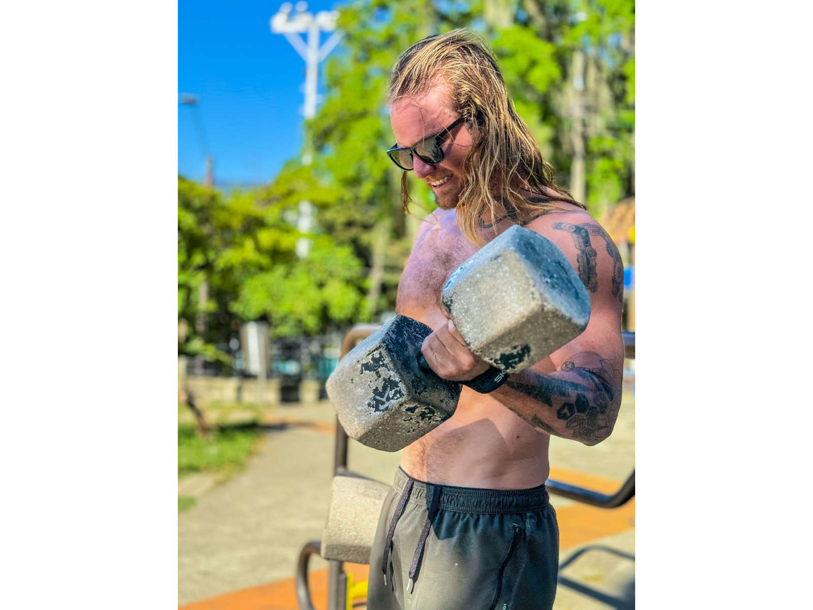 Tom lifts weights